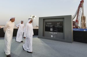 Sheikh Mohammed Bin Rashid al-Maktoum (R), Ruler of Dubai, Mohammad Alabbar (L), chairman of Emaar Properties and Sheikh Hamdan bin Mohammed bin Rashid al-Maktoum (C), Crown Prince of Dubai, are seem during a groundbreaking ceremony of The Tower at Dubai Creek Harbour on October 10, 2016 in the Gulf Emirate. Dubai began construction work on a tower that will stand higher than its Burj Khalifa, which is currently the world's tallest skyscraper. Designed by Spanish-Swiss architect Santiago Calatrava Valls, the tower will have observation decks providing 360-degree views of the coastal city. / AFP PHOTO / STRINGER